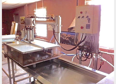 Machine à fabriquer - des dosettes de café