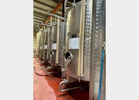 Stainless steel tank - Exterior finish: bush hammered - Conical bottom on legs